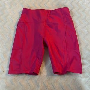 Womens pink athletic shorts with 2 side pockets size xs (0-2)